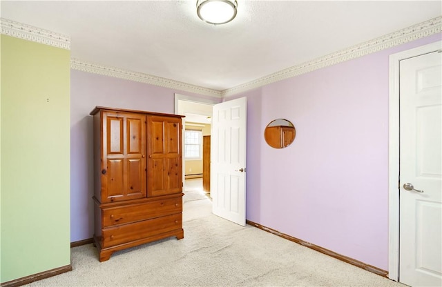 carpeted bedroom featuring baseboard heating