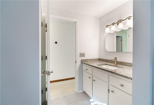 bathroom featuring tile patterned flooring and vanity