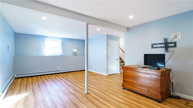 interior space featuring light wood-type flooring and baseboard heating