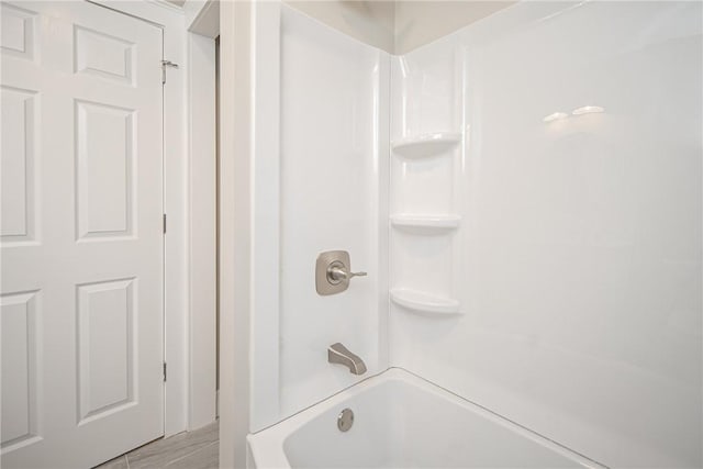 bathroom with shower / bathing tub combination