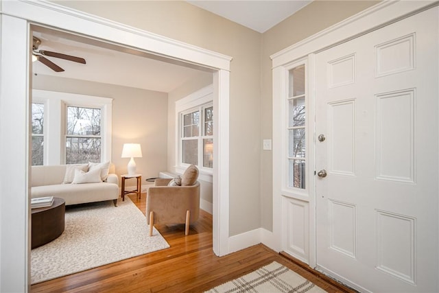 foyer entrance featuring hardwood / wood-style flooring and ceiling fan