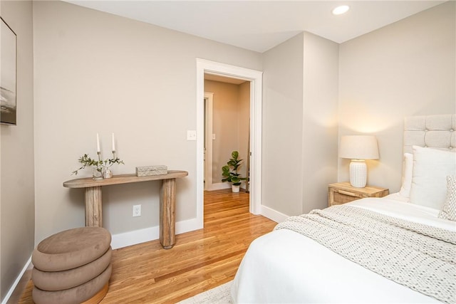 bedroom with hardwood / wood-style floors