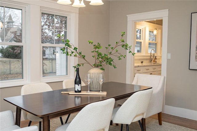 dining room featuring light hardwood / wood-style floors and sink