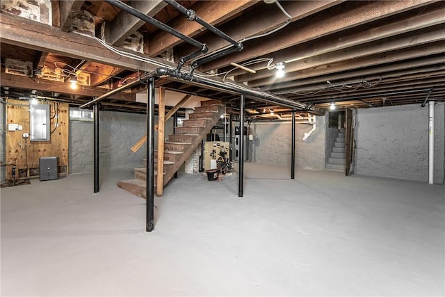 basement with gas water heater and electric panel