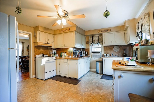 kitchen featuring ceiling fan, white cabinetry, white appliances, and tasteful backsplash