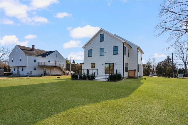 rear view of house with a yard