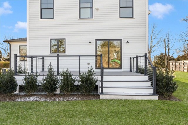 back of house featuring a yard