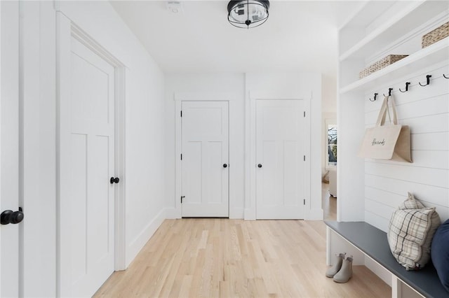 mudroom with light hardwood / wood-style flooring