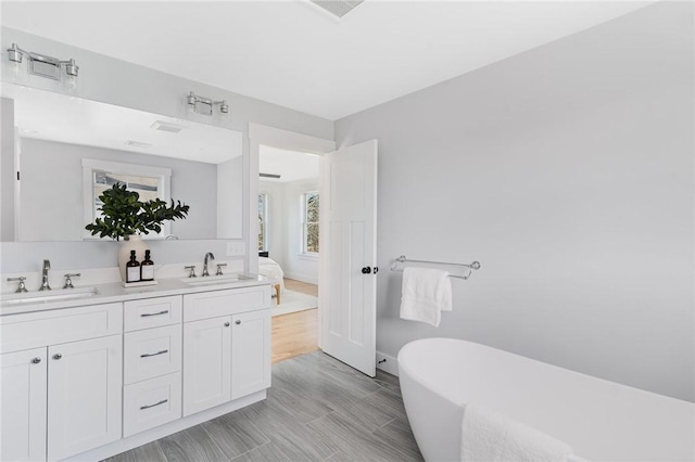 bathroom featuring a bathtub and vanity