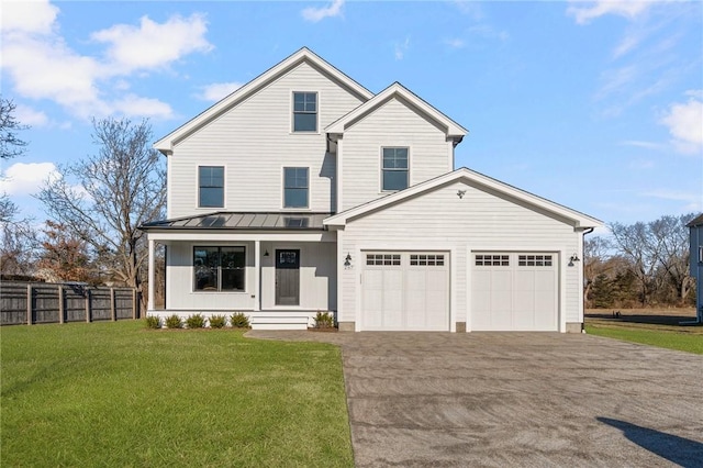 view of front of home with a garage and a front yard