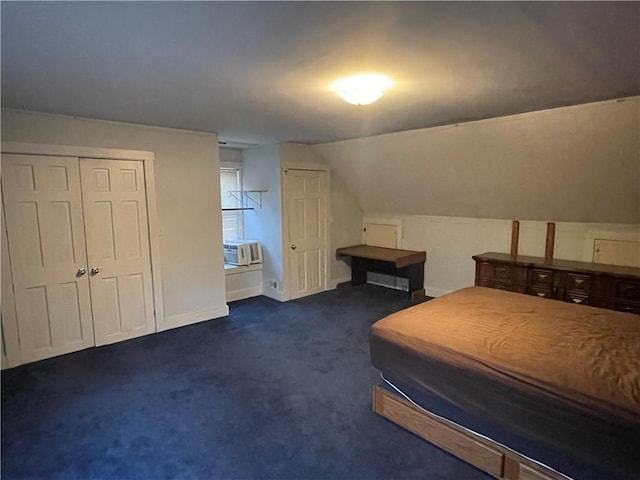 unfurnished bedroom with cooling unit, dark carpet, and vaulted ceiling