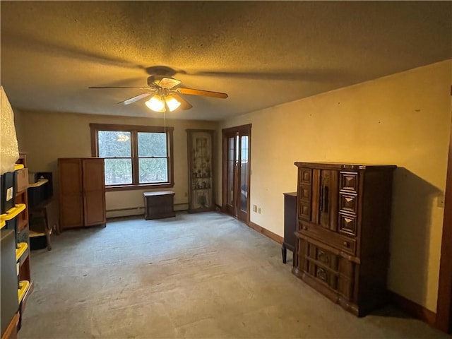 miscellaneous room with a textured ceiling, baseboard heating, and ceiling fan