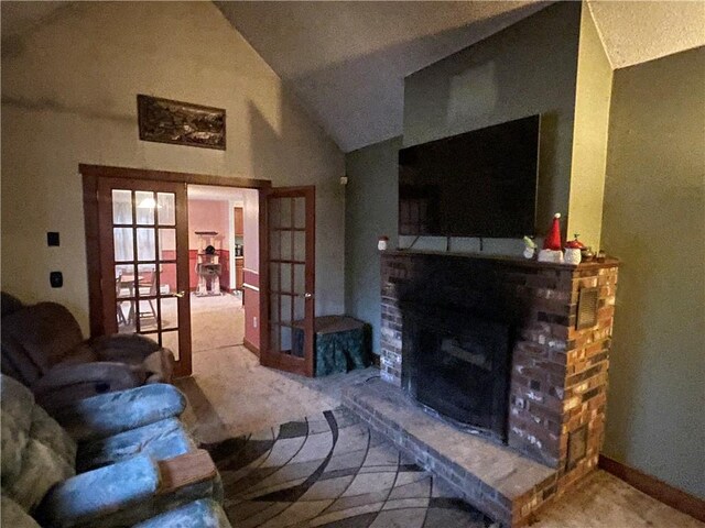 carpeted living room featuring french doors, lofted ceiling, and a brick fireplace