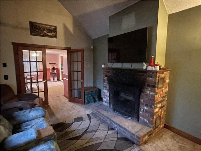 carpeted living room with a fireplace, french doors, and lofted ceiling