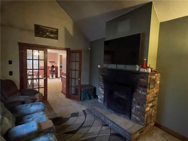 living room with a fireplace, lofted ceiling, light carpet, and french doors