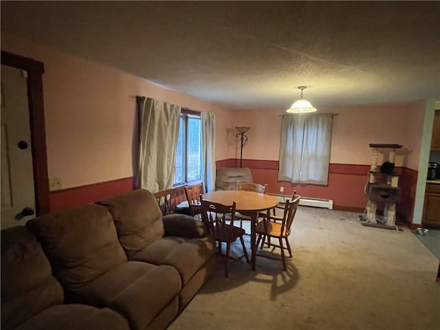 dining space featuring carpet and baseboard heating