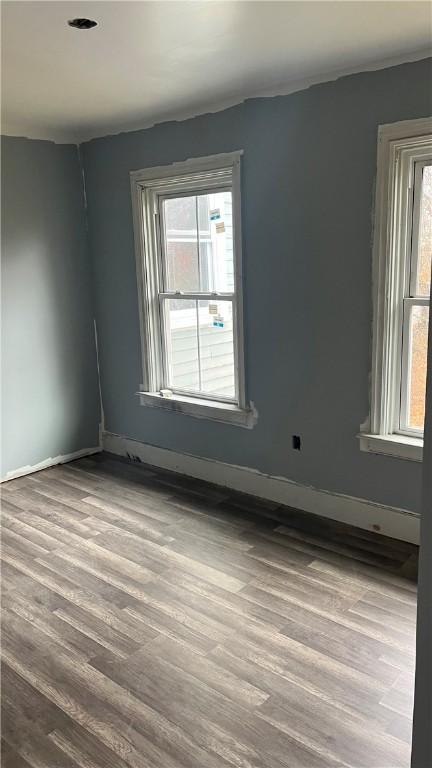 empty room featuring hardwood / wood-style flooring