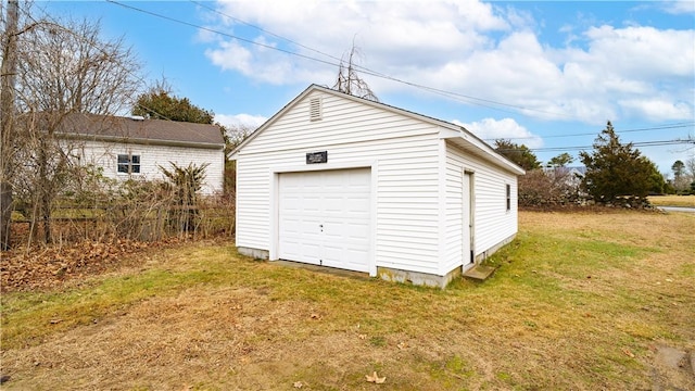 garage with a lawn