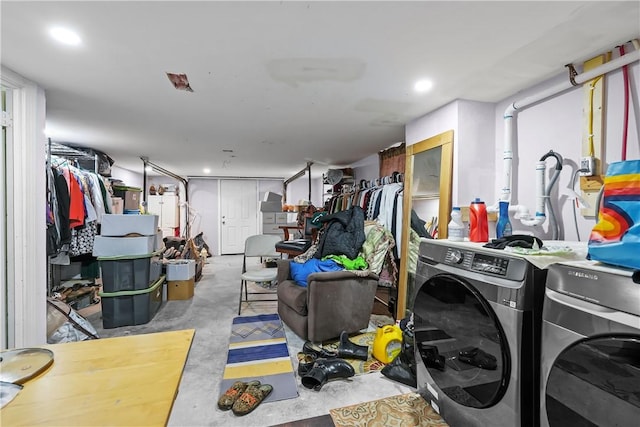 washroom with washing machine and clothes dryer