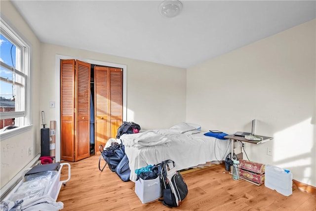 bedroom with light wood-type flooring