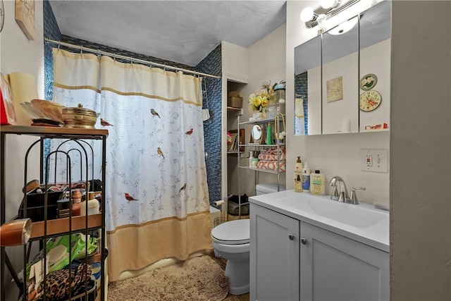 full bathroom featuring vanity, toilet, and shower / bath combo with shower curtain