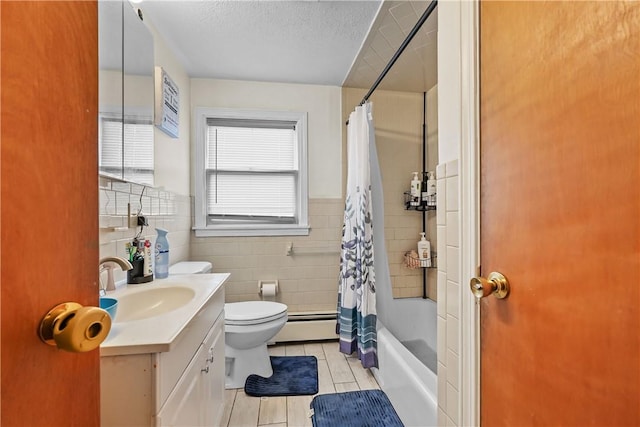 full bathroom with vanity, tile patterned floors, toilet, tile walls, and shower / tub combo