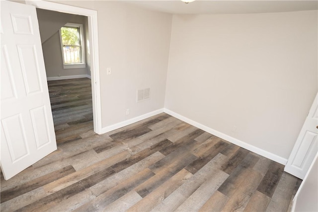 empty room featuring dark hardwood / wood-style floors