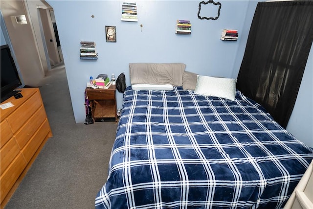 bedroom featuring dark colored carpet