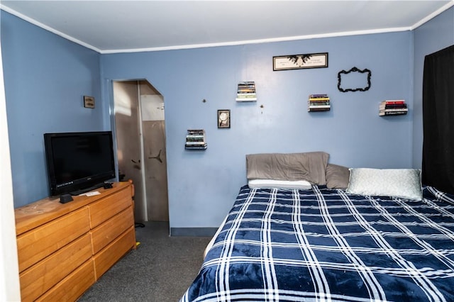 carpeted bedroom with ornamental molding