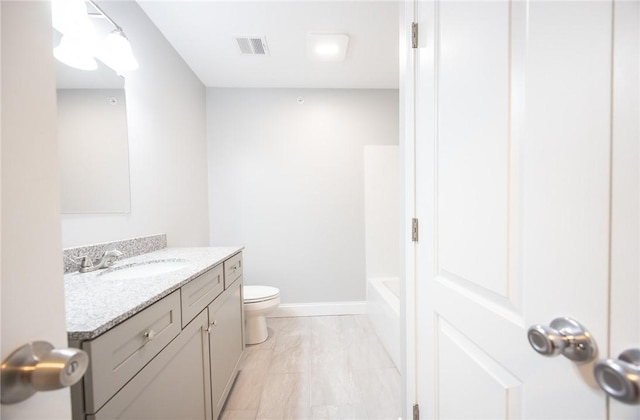 bathroom with vanity and toilet