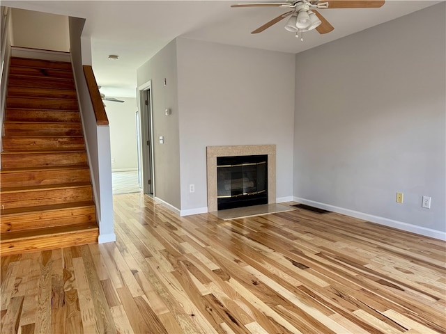 unfurnished living room with light hardwood / wood-style floors and ceiling fan