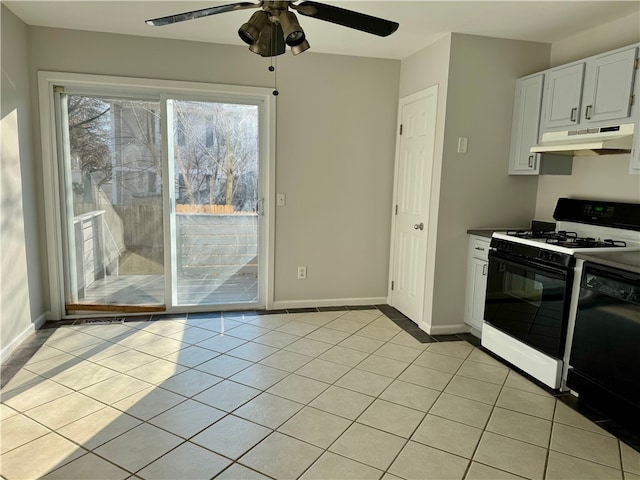 kitchen featuring dishwasher, white cabinets, ceiling fan, gas range gas stove, and light tile patterned flooring