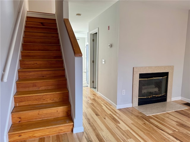 stairway featuring hardwood / wood-style flooring