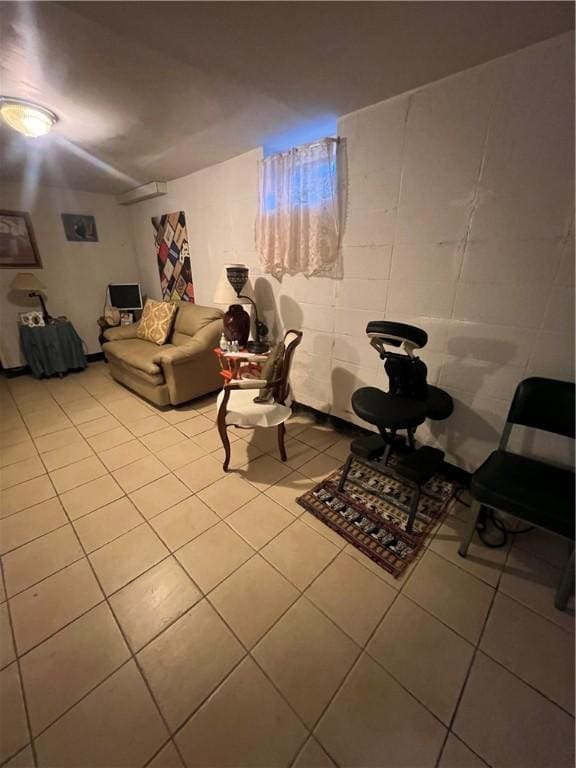 tiled living room with a wall mounted air conditioner