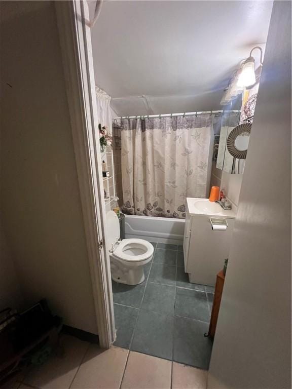 full bathroom featuring tile patterned floors, vanity, toilet, and shower / bathtub combination with curtain