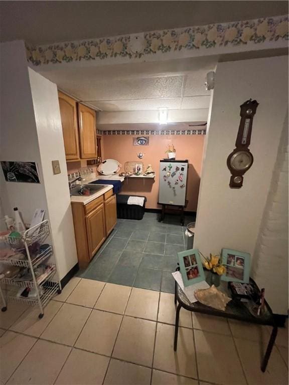 kitchen with tile patterned floors and sink