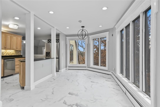 dining area with a baseboard heating unit