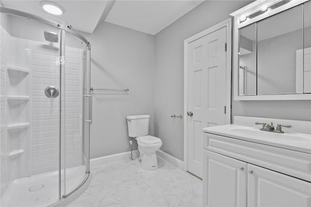 bathroom featuring vanity, toilet, and an enclosed shower