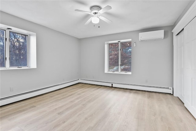 unfurnished bedroom featuring a wall mounted air conditioner, multiple windows, ceiling fan, and a baseboard heating unit