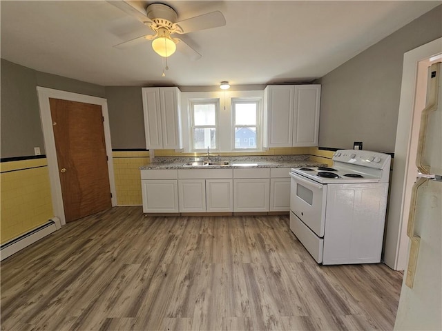 kitchen with white cabinets, light hardwood / wood-style flooring, ceiling fan, and electric stove