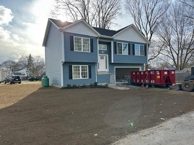 bi-level home featuring a garage