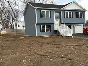 raised ranch featuring a garage