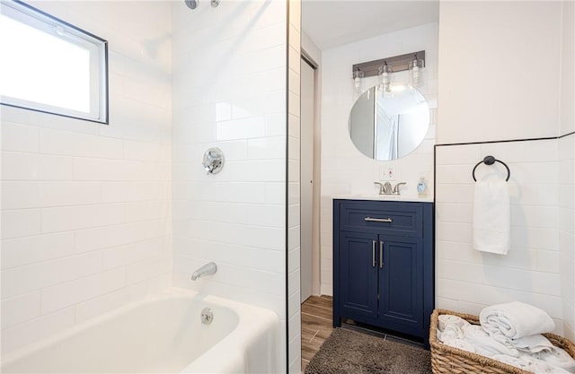 bathroom featuring shower / tub combination and vanity