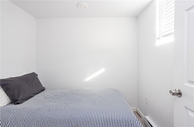 bedroom featuring a baseboard radiator