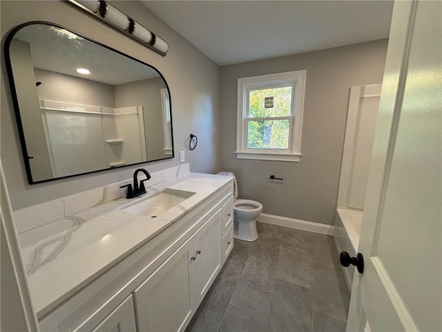 bathroom featuring vanity and toilet