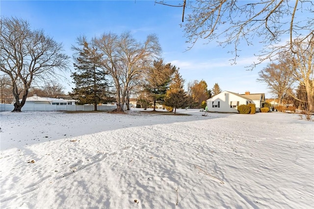 view of yard layered in snow