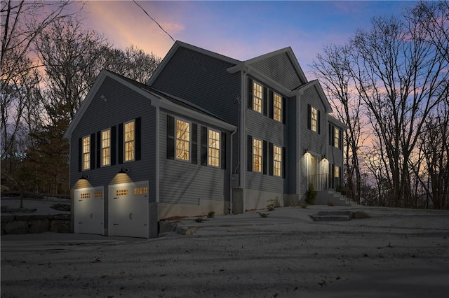 property exterior at dusk with a garage