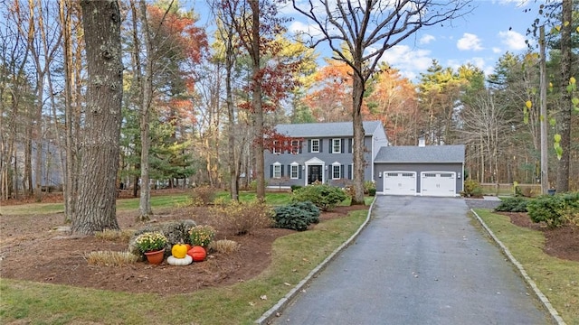 colonial house featuring a garage