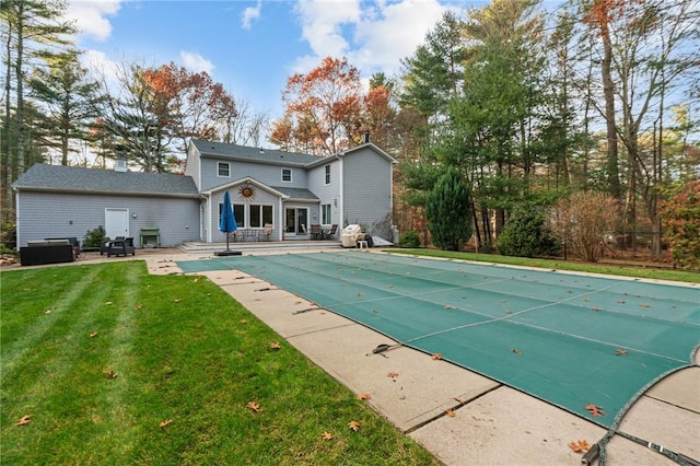 view of swimming pool with a patio area and a lawn