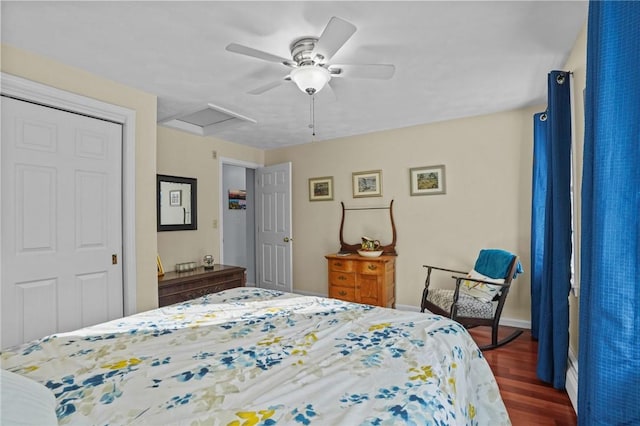 bedroom featuring a closet, dark hardwood / wood-style floors, and ceiling fan